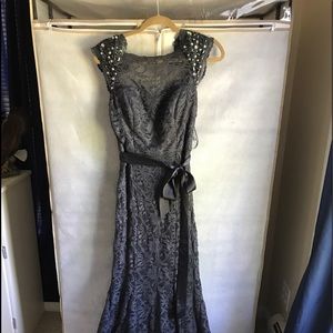 Formal Dark Gray Gown with capped sleeves.